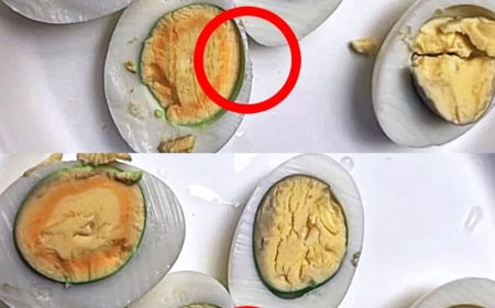 Why do we observe a greenish ring around the yolk of hard-boiled eggs