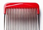 I found a tiny red object in a kitchen drawer that looks like a comb and has lengthy metal prongs. Do you know what it is