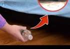 Why should you throw a bottle of water under the bed as soon as you check into a hotel?